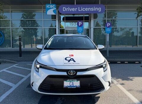 CA Driving School training car parked outside ICBC Driver Licensing in BC